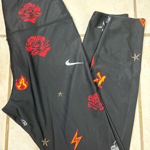 Nike Kids Black Leggings with Red and Orange Designs